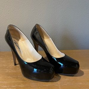 Brian Atwood black patent pumps